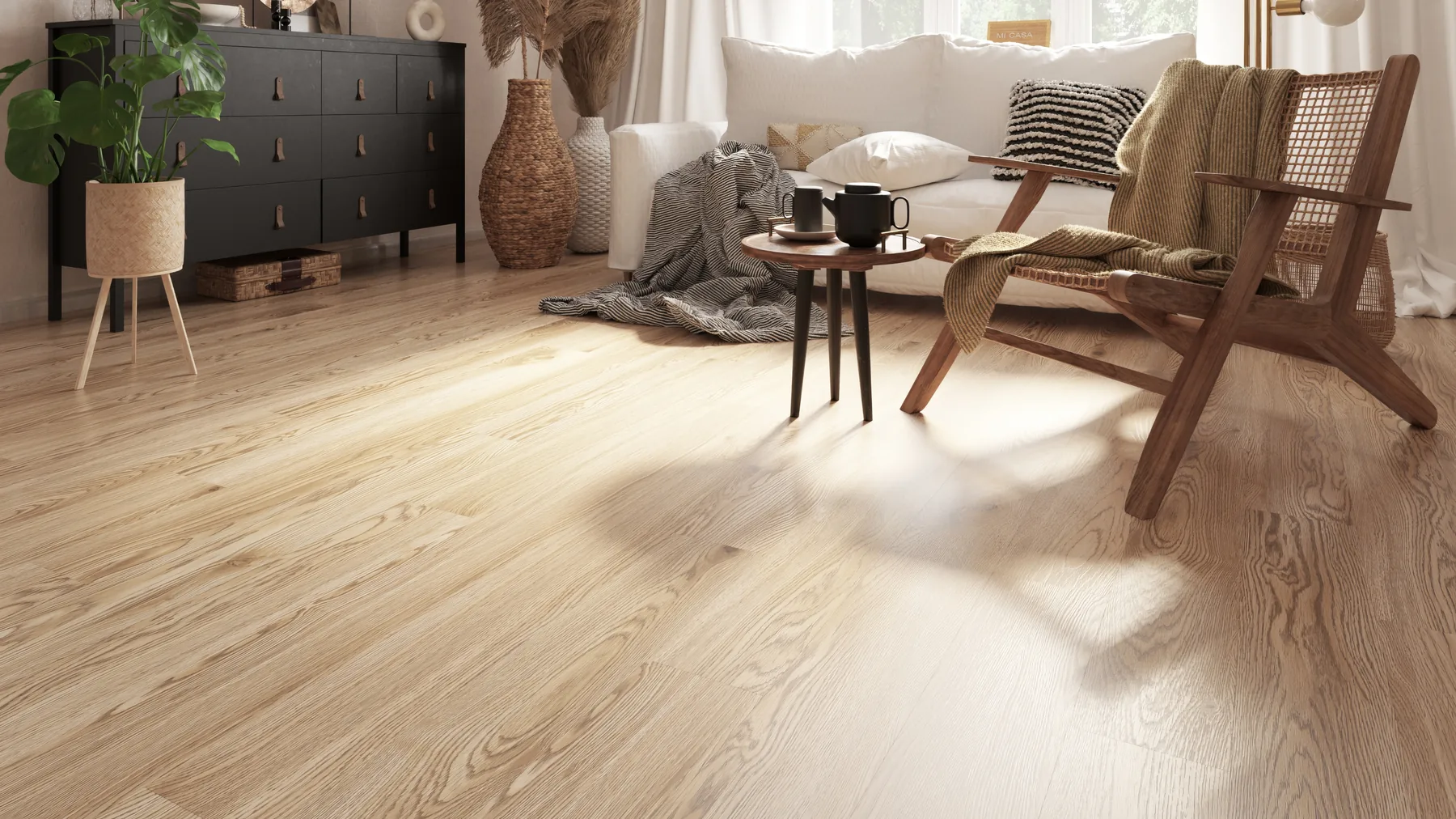 Light oak vinyl plank flooring in a furnished living room with a cane lounge chair
